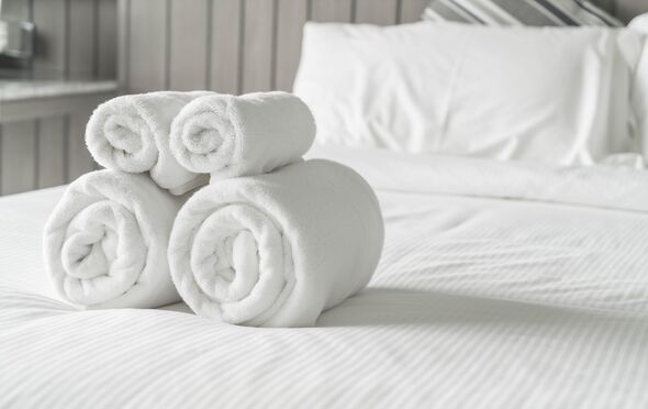 Towels folded on hotel bed